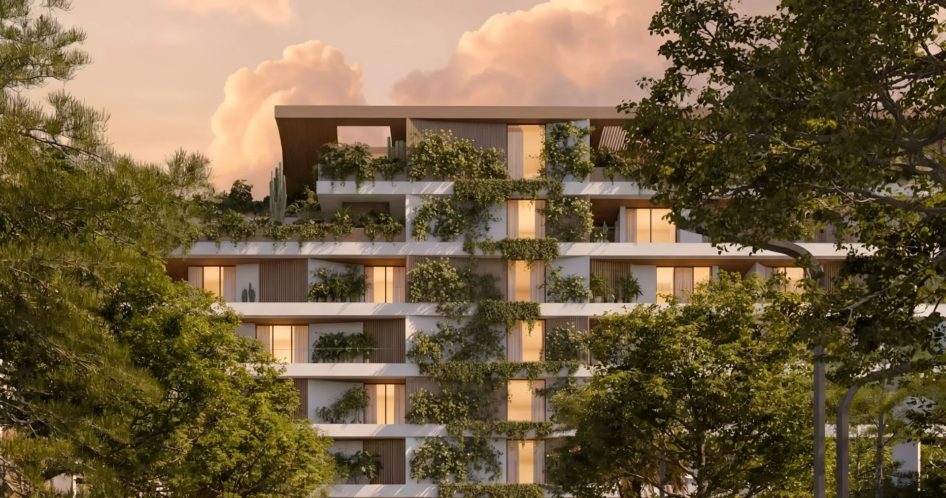 Lunaya Terraces facade draped in cascading greenery at dusk