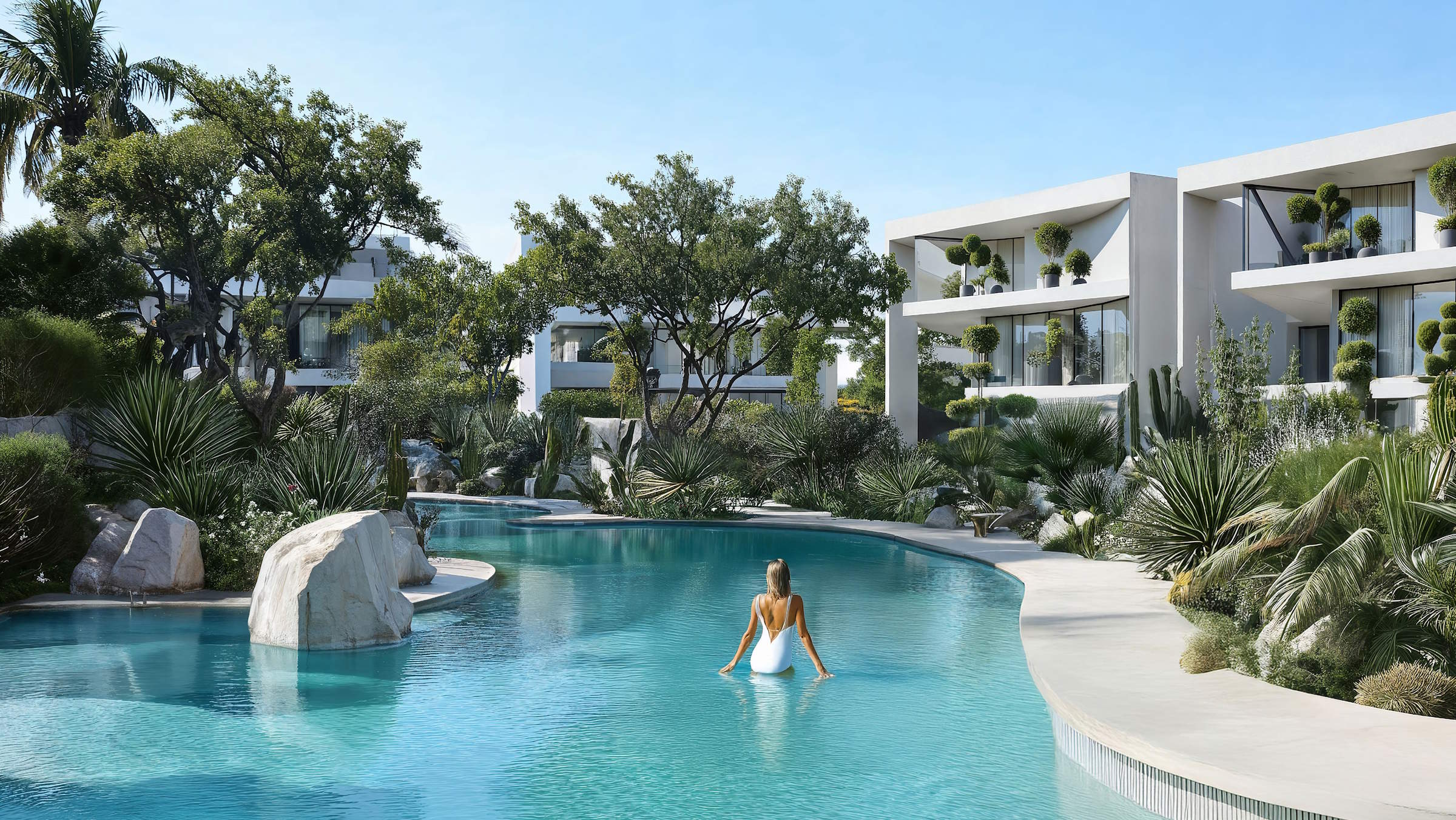 Lunaya resort-style pool surrounded by landscaped gardens